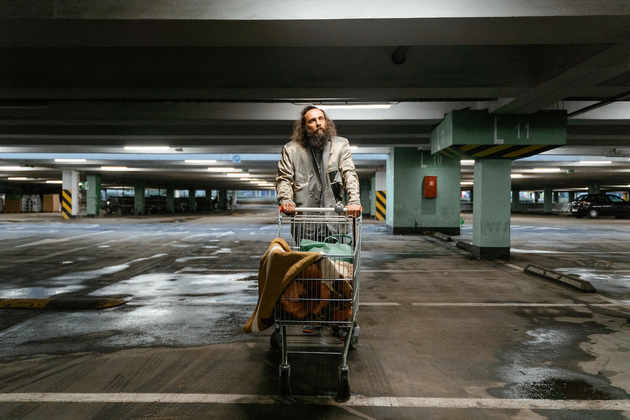 Bearded Man Pushing a Grocery Cart | Veteran Car Donations