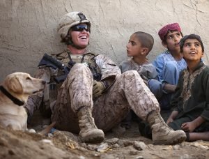 American Soldier Laughing around Kids - VeteranCarDonations.org